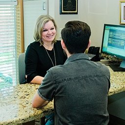 Patient checking in at reception desk