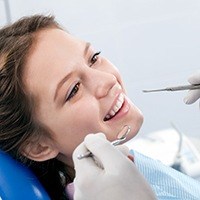 Woman receiving dental exam