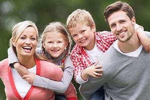 Smiling mother father and two children