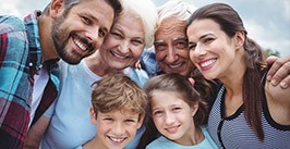 Three generations of family smiling together